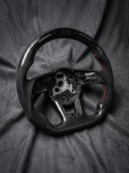 Steering wheel on a textured gray surface