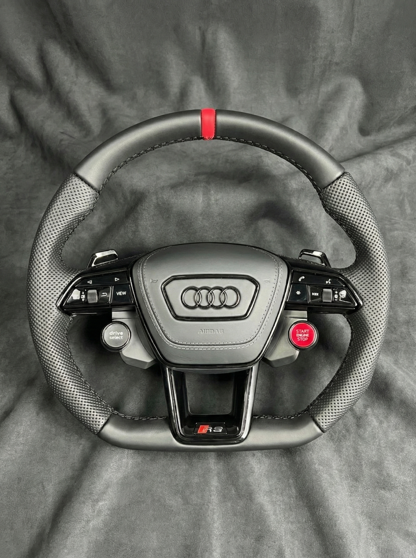 Audi steering wheel on a gray background
