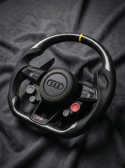 Audi steering wheel on a dark fabric background