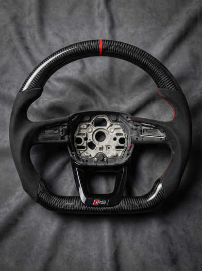 Steering wheel with visible brand logo on a gray background